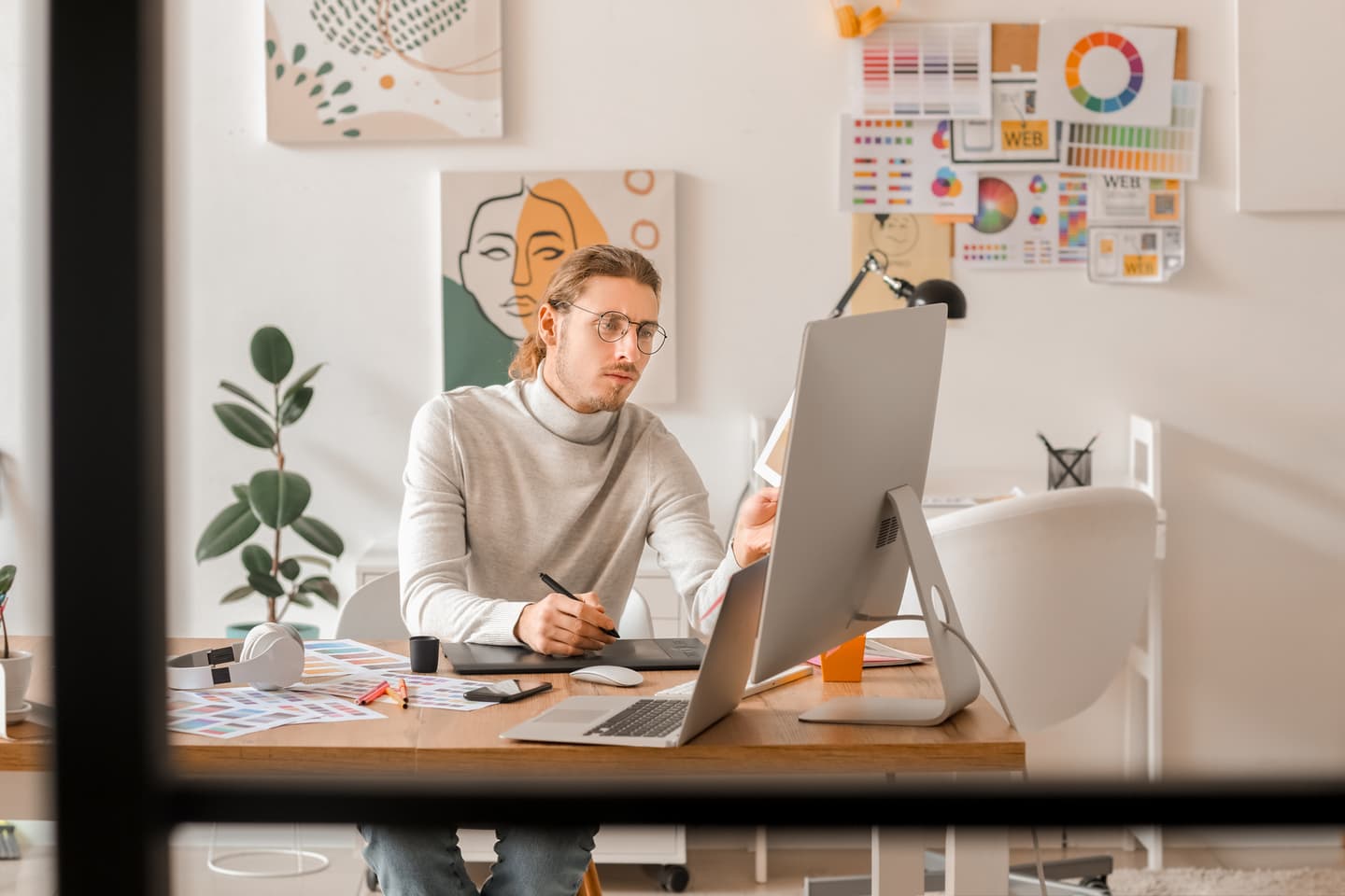 A person seen working at his desktop